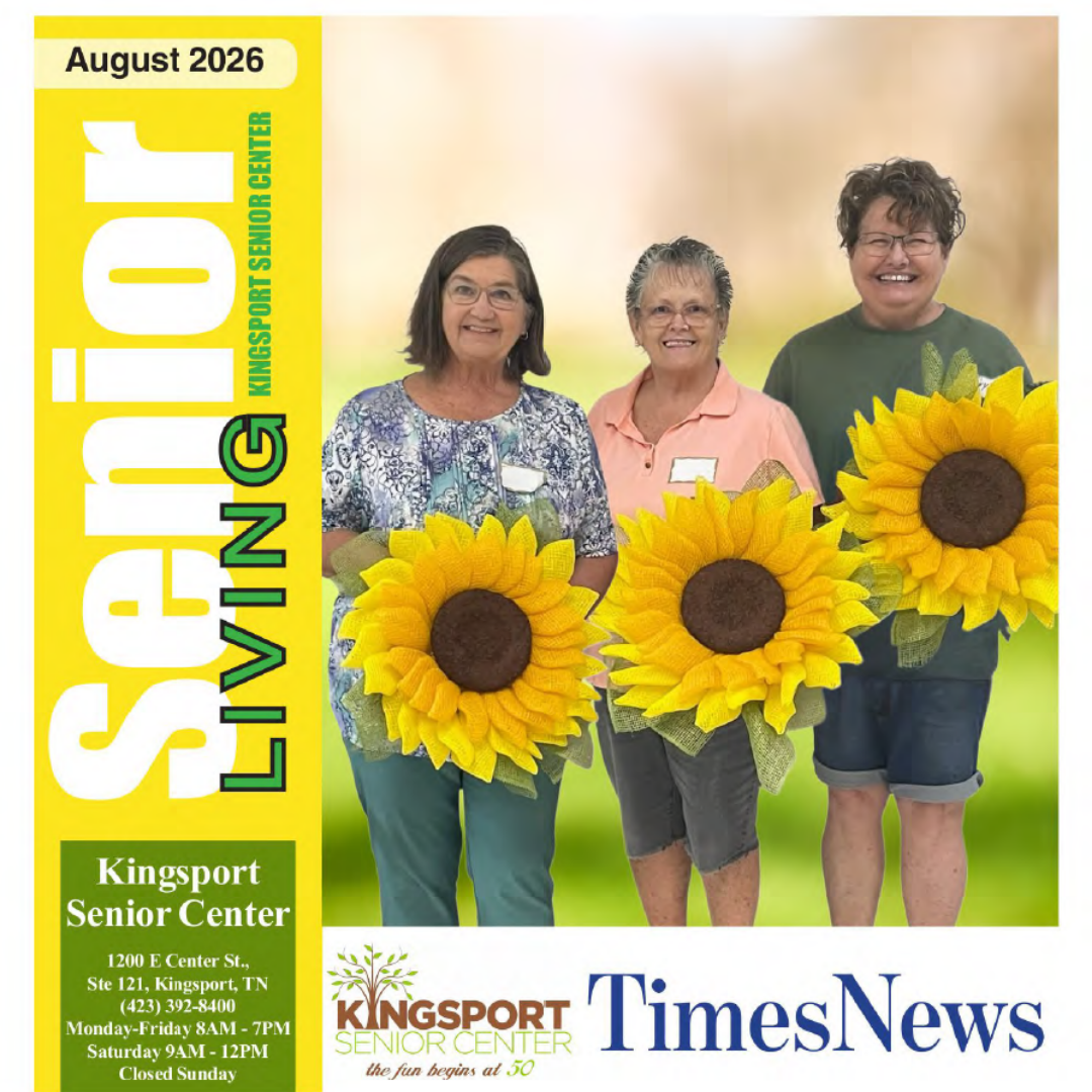 3 women holding sunflowers