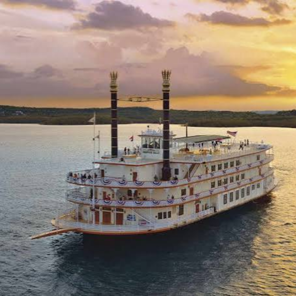 Showboat on a river at sunset